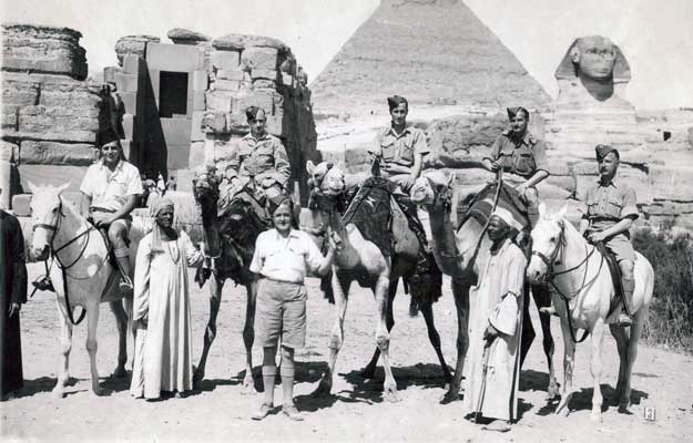 Below the pyramid and Sphinx